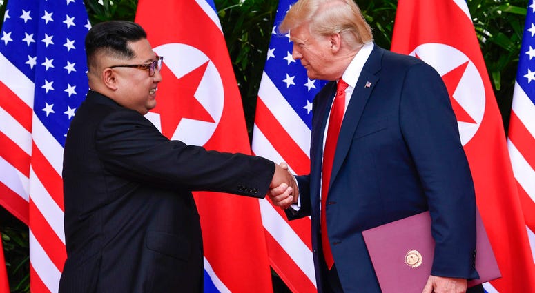 FILE - In this June 12, 2018, file photo, North Korean leader Kim Jong Un, left, and U.S. President Donald Trump shake hands at the conclusion of their meetings at the Capella resort on Sentosa Island in Singapore. FILE - In this June 12, 2018, file photo, North Korean leader Kim Jong Un, left, and U.S. President Donald Trump shake hands at the conclusion of their meetings at the Capella resort on Sentosa Island in Singapore.