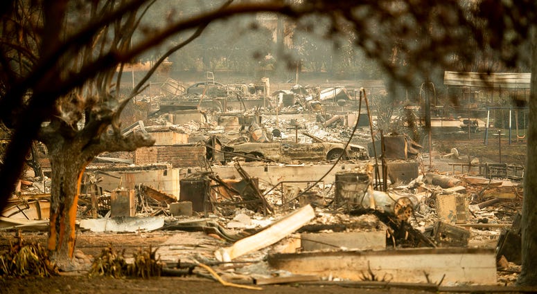 As the Camp Fire burns nearby, a scorched car rests by gas pumps near Pulga, Calif., on Sunday, Nov. 11, 2018. As the Camp Fire burns nearby, a scorched car rests by gas pumps near Pulga, Calif., on Sunday, Nov. 11, 2018.