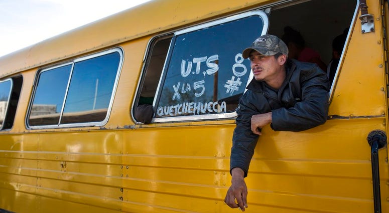 A Central American migrant, part of the caravan hoping to reach the U.S. border, smokes during a stop at a check point in San Luis Rio Colorado in their way to Tijuana, Baja California state, Mexico, Thursday, Nov. 15, 2018. A Central American migrant, part of the caravan hoping to reach the U.S. border, smokes during a stop at a check point in San Luis Rio Colorado in their way to Tijuana, Baja California state, Mexico, Thursday, Nov. 15, 2018.
