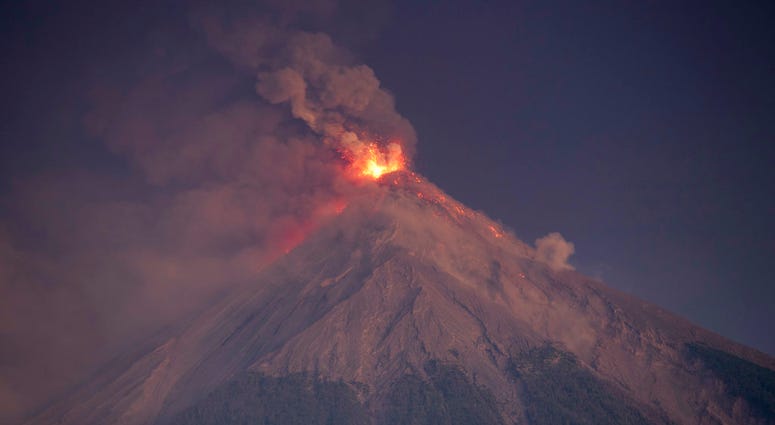 The Volcan de Fuego, or Volcano of Fire, spews hot molten lava and ash from its crater in Escuintla, Guatemala, early Monday, Nov. 19, 2018. The Volcan de Fuego, or Volcano of Fire, spews hot molten lava and ash from its crater in Escuintla, Guatemala, early Monday, Nov. 19, 2018.