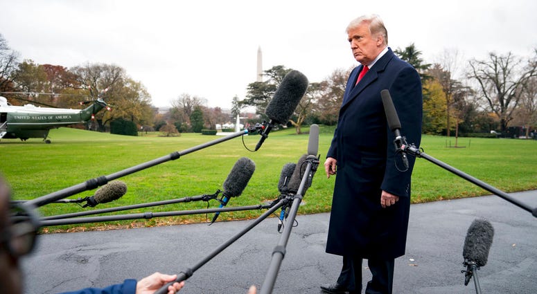 President Donald Trump listens to a question as he speaks to members of the media before boarding Marine One on the South Lawn of the White House in Washington, Monday, Nov. 26, 2018, for a short trip to Andrews Air Force Base, Md., and then on to Mississ President Donald Trump listens to a question as he speaks to members of the media before boarding Marine One on the South Lawn of the White House in Washington, Monday, Nov. 26, 2018, for a short trip to Andrews Air Force Base, Md., and then on to Mississ