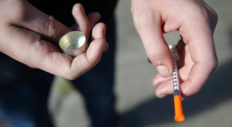 A fentanyl user holds a needle near Kensington and Cambria in Philadelphia. Suicides and drug overdoses helped lead a surge in U.S. deaths last year, and drove a continuing decline in how long Americans are expected to live. A fentanyl user holds a needle near Kensington and Cambria in Philadelphia. Suicides and drug overdoses helped lead a surge in U.S. deaths last year, and drove a continuing decline in how long Americans are expected to live.