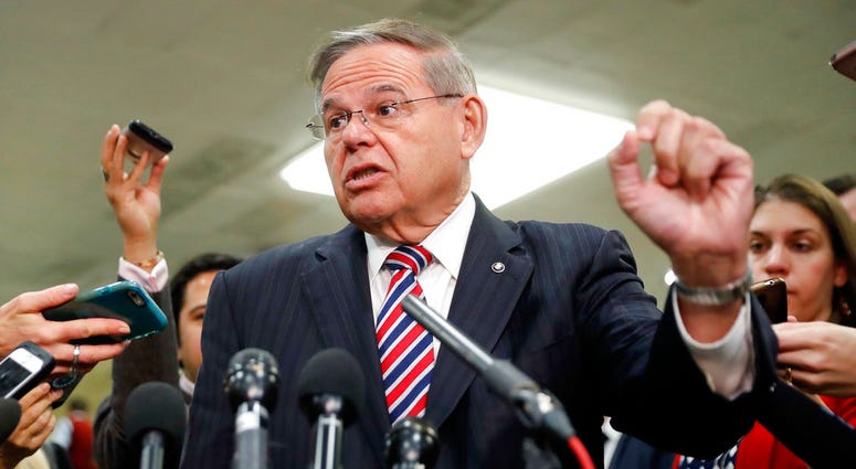 Sen. Bob Menendez, D-N.J., speaks to members of the media after leaving a closed door meeting about Saudi Arabia with Secretary of State Mike Pompeo, Nov. 28, 2018, on Capitol Hill in Washington. Sen. Bob Menendez speaks to members of the media.