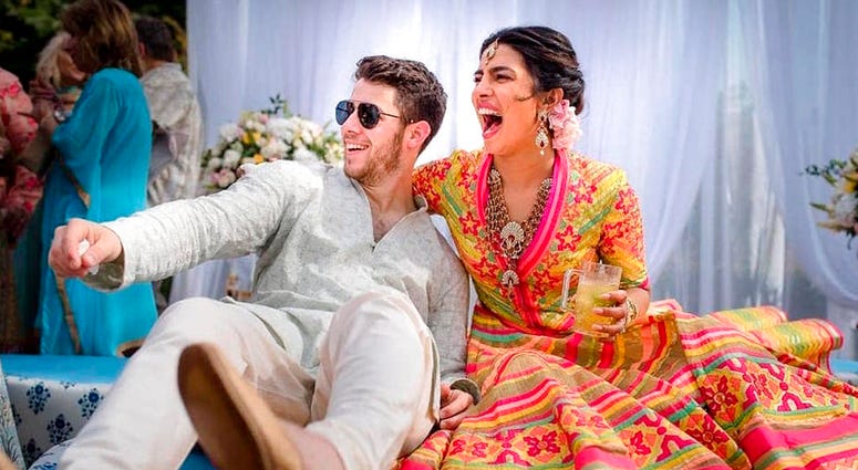 In this Friday, Nov. 30, 2018 handout photo released by Raindrop Media, Bollywood actress Priyanka Chopra and Nick Jonas celebrate during a mehendi ceremony, a day before their wedding, at Umaid Bhawan in Jodhpur, India. In this Friday, Nov. 30, 2018 handout photo released by Raindrop Media, Bollywood actress Priyanka Chopra and Nick Jonas celebrate during a mehendi ceremony, a day before their wedding, at Umaid Bhawan in Jodhpur, India.