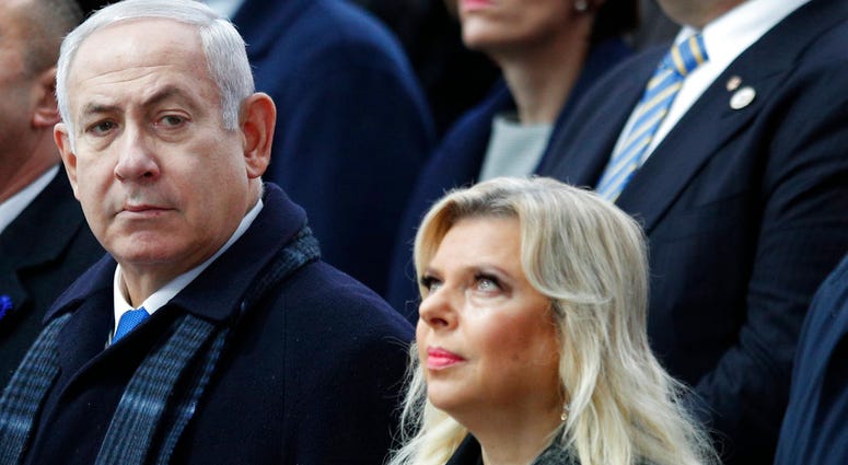 FILE - In this Nov. 11, 2018, file photo, Israeli Prime Minister Benjamin Netanyahu and his wife Sara attend ceremonies at the Arc de Triomphe in Paris. FILE - In this Nov. 11, 2018, file photo, Israeli Prime Minister Benjamin Netanyahu and his wife Sara attend ceremonies at the Arc de Triomphe in Paris.