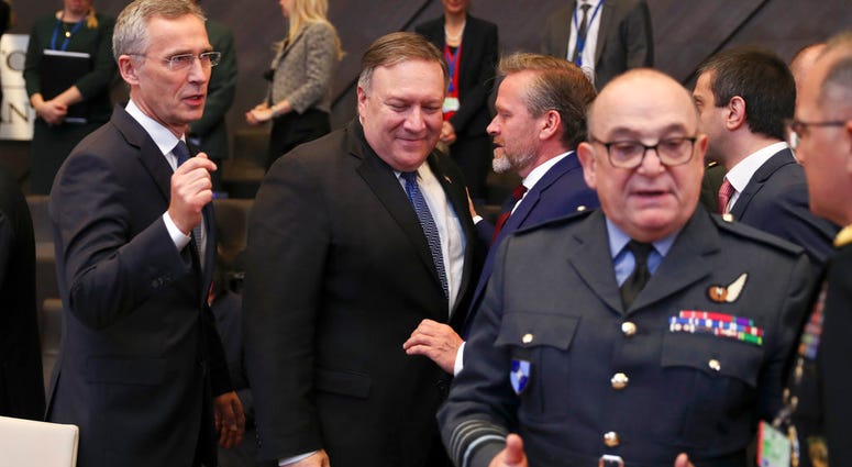 U.S. Secretary of State Mike Pompeo, center, and NATO Secretary General Jens Stoltenberg, right, arrive for a round table meeting of the North Atlantic Council with Georgia and Ukraine at NATO headquarters in Brussels, Tuesday, Dec. 4, 2018. U.S. Secretary of State Mike Pompeo, center, and NATO Secretary General Jens Stoltenberg, right, arrive for a round table meeting of the North Atlantic Council with Georgia and Ukraine at NATO headquarters in Brussels, Tuesday, Dec. 4, 2018.
