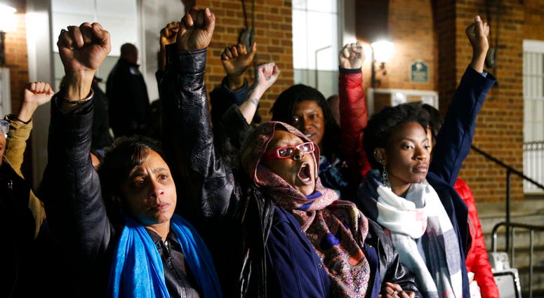 Local activists raise their fists outside Charlottesville General District Court after a guilty verdict was reached in the trial of James Alex Fields Jr., in Charlottesville, Va., Friday, Dec. 7, 2018. Local activists raise their fists outside Charlottesville General District Court after a guilty verdict was reached in the trial of James Alex Fields Jr., in Charlottesville, Va., Friday, Dec. 7, 2018.