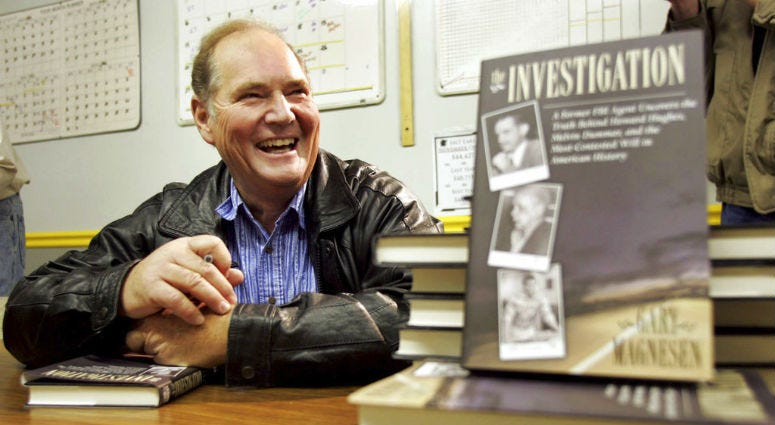 FILE - In this Nov. 10, 2005 file photo, Melvin Dummar smiles after signing copies of a book that Gary Magnesen had written about Dummar's claims that Howard Hughes left him a portion of the Hughes estate. FILE - In this Nov. 10, 2005 file photo, Melvin Dummar smiles after signing copies of a book that Gary Magnesen had written about Dummar's claims that Howard Hughes left him a portion of the Hughes estate.