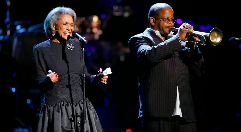 In this Oct. 28, 2007 file photo, Nancy Wilson, left, and Terence Blanchard, right, perform during an all-star tribute concert for Herbie Hancock, in Los Angeles. Nancy Wilson