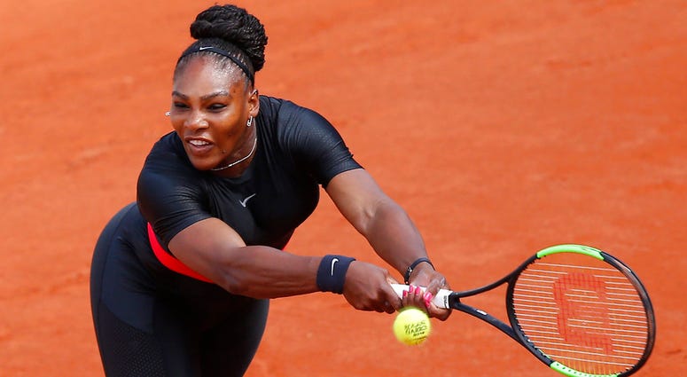 In this May 29, 2018, file photo, Serena Williams returns a shot against Krystyna Pliskova during their first-round match of the French Open tennis tournament in Paris, France. Serena Williams
