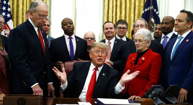 President Donald Trump speaks during a signing ceremony for criminal justice reform legislation in the Oval Office of the White House, Friday, Dec. 21, 2018, in Washington. President Donald Trump speaks during a signing ceremony for criminal justice reform legislation in the Oval Office of the White House, Friday, Dec. 21, 2018, in Washington.