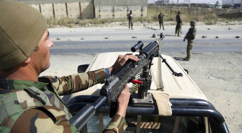 In this Wednesday, Oct. 17, 2018, photo, Afghan National Army soldiers stand guard at a checkpoint in Kabul, Afghanistan. In this Wednesday, Oct. 17, 2018, photo, Afghan National Army soldiers stand guard at a checkpoint in Kabul, Afghanistan.
