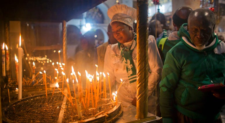 Christian worshippers light candles at the Church of the Nativity, traditionally recognized by Christians to be the birthplace of Jesus Christ, in the West Bank city of Bethlehem, Sunday, Dec. 23, 2018. Christian worshippers light candles at the Church of the Nativity, traditionally recognized by Christians to be the birthplace of Jesus Christ, in the West Bank city of Bethlehem, Sunday, Dec. 23, 2018.