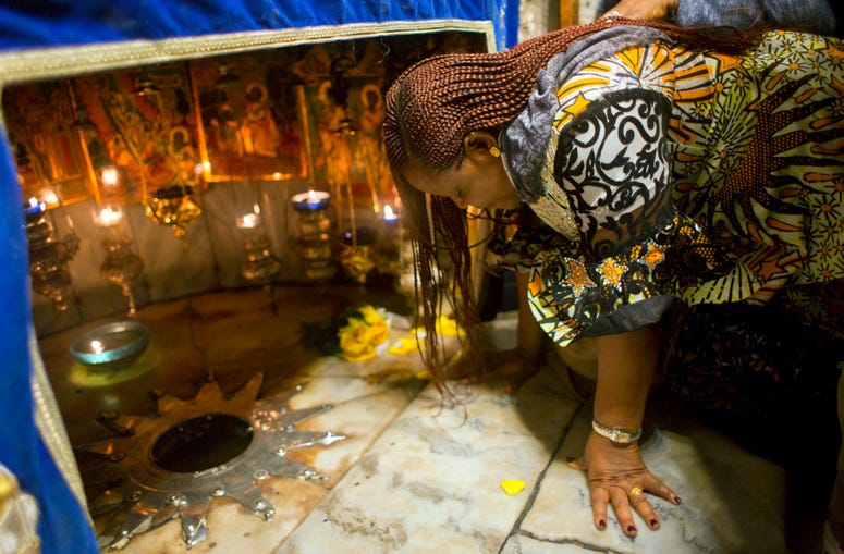 A Christian worshipper prays at the Grotto, under the Church of the Nativity, traditionally recognized by Christians to be the birthplace of Jesus Christ, in the West Bank city of Bethlehem, Sunday, Dec. 23, 2018. A Christian worshipper prays at the Grotto, under the Church of the Nativity, traditionally recognized by Christians to be the birthplace of Jesus Christ, in the West Bank city of Bethlehem, Sunday, Dec. 23, 2018.