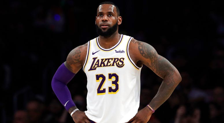 In this Dec. 23, 2018, file photo, Los Angeles Lakers' LeBron James stands during the first half of an NBA basketball game against the Memphis Grizzlies in Los Angeles. LeBron James