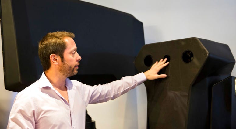 Product manager Asaf Lebovitz from the Israeli anti-drone company Skylock, explains their system's main unit at the company's offices in Petah Tikvah, Israel, Tuesday, Dec. 25, 2018. Product manager Asaf Lebovitz from the Israeli anti-drone company Skylock.