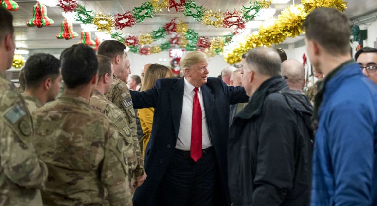 President Donald Trump visits with members of the military at a dining hall at Al Asad Air Base, Iraq, Wednesday, Dec. 26, 2018. President Donald Trump visits with members of the military at a dining hall at Al Asad Air Base, Iraq, Wednesday, Dec. 26, 2018.