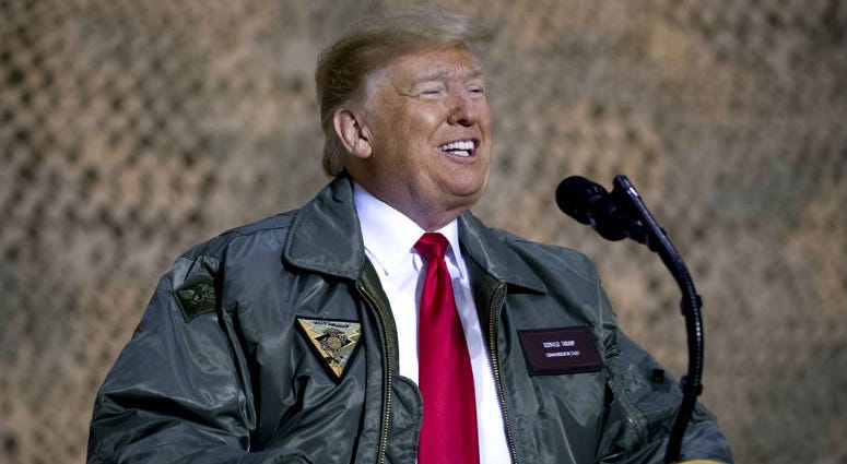 President Donald Trump speaks at a hanger rally at Al Asad Air Base, Iraq, Wednesday, Dec. 26, 2018. President Donald Trump speaks at a hanger rally at Al Asad Air Base, Iraq, Wednesday, Dec. 26, 2018.