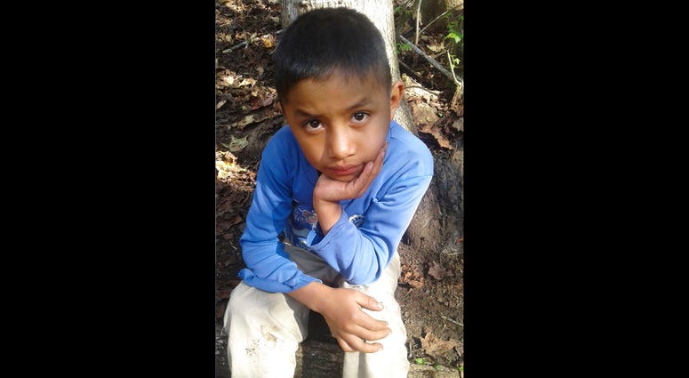 This Dec, 12, 2018 photo provided by Catarina Gomez on Thursday, Dec. 27, 2018, shows her half-brother Felipe Gomez Alonzo, 8, near her home in Yalambojoch, Guatemala. Felipe Gomez Alonzo