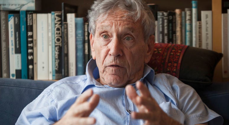 In this Nov. 4, 2015 file photo, Israeli writer Amos Oz poses for a photo at his house in Tel Aviv, Israel. Amos Oz