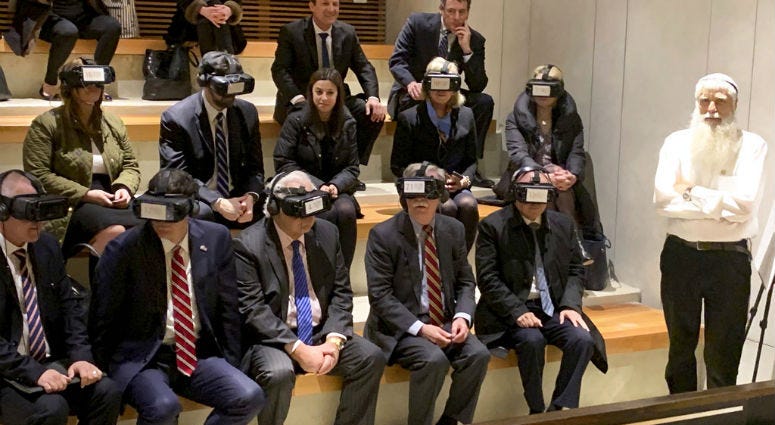 U.S. National Security Adviser John Bolton, seated front row forth from left, participates in a virtual reality demonstration at the Western Wall on Sunday, Jan. 6, 2019, in Jerusalem. U.S. National Security Adviser John Bolton, seated front row forth from left, participates in a virtual reality demonstration at the Western Wall on Sunday, Jan. 6, 2019, in Jerusalem.