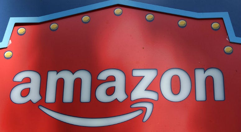 FILE - This Oct. 23, 2018, file photo shows an Amazon logo atop the Amazon Treasure Truck The Park DTLA office complex in downtown Los Angeles. FILE - This Oct. 23, 2018, file photo shows an Amazon logo atop the Amazon Treasure Truck The Park DTLA office complex in downtown Los Angeles.