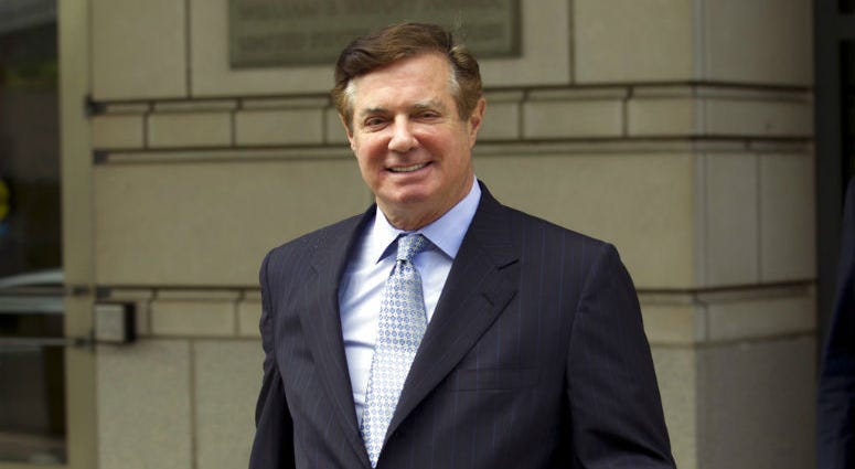 FILE - In this May 23, 2018, file photo, Paul Manafort, President Donald Trump's former campaign chairman, leaves the Federal District Court after a hearing in Washington. FILE - In this May 23, 2018, file photo, Paul Manafort, President Donald Trump's former campaign chairman, leaves the Federal District Court after a hearing in Washington.