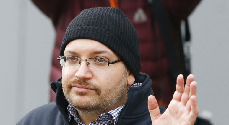 FILE - In this Jan. 20, 2016, file photo, Washington Post reporter Jason Rezaian waves at Landstuhl Regional Medical Center in Landstuhl, Germany. FILE - In this Jan. 20, 2016, file photo, Washington Post reporter Jason Rezaian waves at Landstuhl Regional Medical Center in Landstuhl, Germany.
