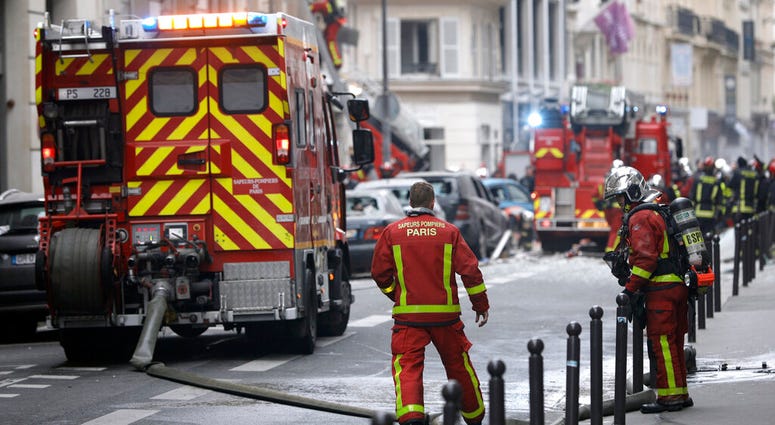 Firefighters work at the scene of a gas leak explosion in Paris, France, Saturday, Jan. 12, 2019. Paris police say several people have been injured in an explosion and fire at a bakery believed caused by a gas leak. Paris Bakery Blast