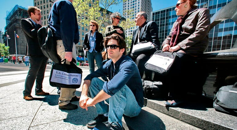 In this April 29, 2010 file photo, census employees, including Joseph Mintz, seated, and Lesley Rubinger, far right, assemble after a training course in New York. In this April 29, 2010 file photo, census employees, including Joseph Mintz, seated, and Lesley Rubinger, far right, assemble after a training course in New York.