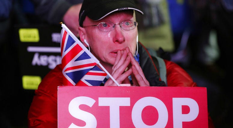An anti-Brexit demonstrator cries as he gathers in Parliament square in London, Tuesday, Jan. 15, 2019. An anti-Brexit demonstrator cries as he gathers in Parliament square in London, Tuesday, Jan. 15, 2019.
