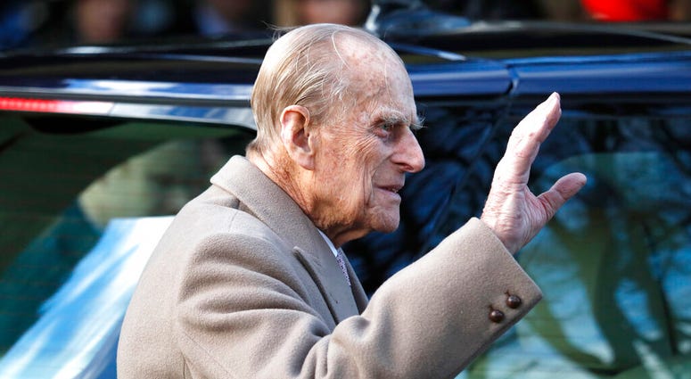 In this Sunday, Dec. 25, 2016 file photo, Britain's Prince Philip waves to the public as he leaves after attending a Christmas day church service in Sandringham, England. Prince Philip