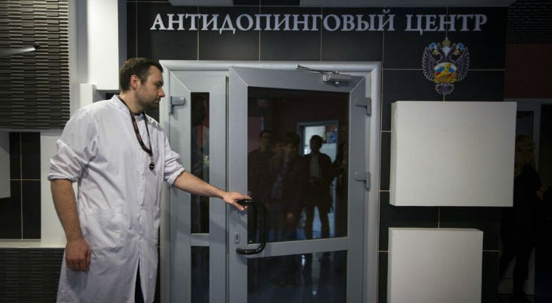 FILE - In this Tuesday, May 24, 2016 file photo, Grigory Dudko opens a door for journalists during a visit to Russia's national drug-testing laboratory in Moscow, Russia. FILE - In this Tuesday, May 24, 2016 file photo, Grigory Dudko opens a door for journalists during a visit to Russia's national drug-testing laboratory in Moscow, Russia.