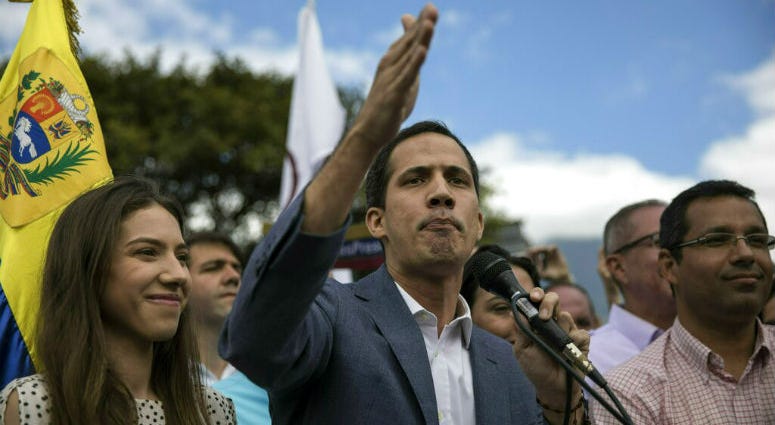 Venezuela's self-declared interim leader Juan Guaido, accompanied by his wife Fabiana Rosales, speaks to supporters during a gathering to propose amnesty laws for police and military, at a public plaza in Las Mercedes neighborhood of Caracas, Venezuela, S Venezuela's self-declared interim leader Juan Guaido, accompanied by his wife Fabiana Rosales, speaks to supporters during a gathering to propose amnesty laws for police and military, at a public plaza in Las Mercedes neighborhood of Caracas, Venezuela, S