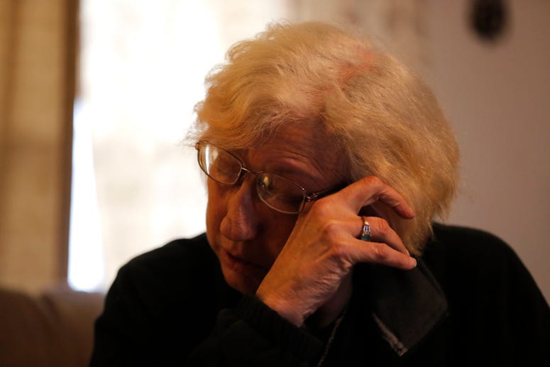 Kim Mincks reacts inside her home in Gonzalez, La., Sunday, Jan. 27, 2019, where two of her housemates, Keith Theriot and his wife Elizabeth Theriot, were killed in another room yesterday while she slept. Kim Mincks reacts inside her home in Gonzalez, La., Sunday, Jan. 27, 2019, where two of her housemates, Keith Theriot and his wife Elizabeth Theriot, were killed in another room yesterday while she slept.