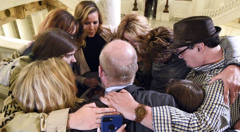 FILE- In this file photo from Oct. 17, 2018, survivors of child sexual abuse hug in the Pennsylvania Capitol in Harrisburg, Pa. FILE- In this file photo from Oct. 17, 2018, survivors of child sexual abuse hug in the Pennsylvania Capitol in Harrisburg, Pa.