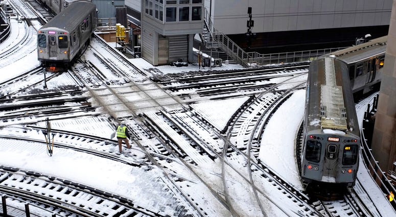 Chicago's El trains move along snow-covered tracks Monday, Jan. 28, 2019, in Chicago. The plunging temperatures expected later this week that have forecasters especially concerned. Chicago's El trains move along snow-covered tracks Monday, Jan. 28, 2019, in Chicago. The plunging temperatures expected later this week that have forecasters especially concerned.