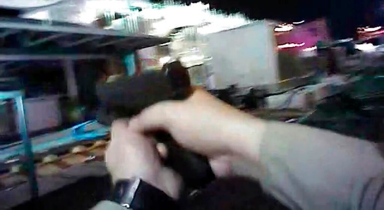 In this Oct. 1, 2017, file image taken from police body cam video released by the Las Vegas Metropolitan Police Department on July 25, 2018, an armed law enforcement official points his gun while searching for a shooter in Las Vegas. In this Oct. 1, 2017, file image taken from police body cam video released by the Las Vegas Metropolitan Police Department on July 25, 2018, an armed law enforcement official points his gun while searching for a shooter in Las Vegas.