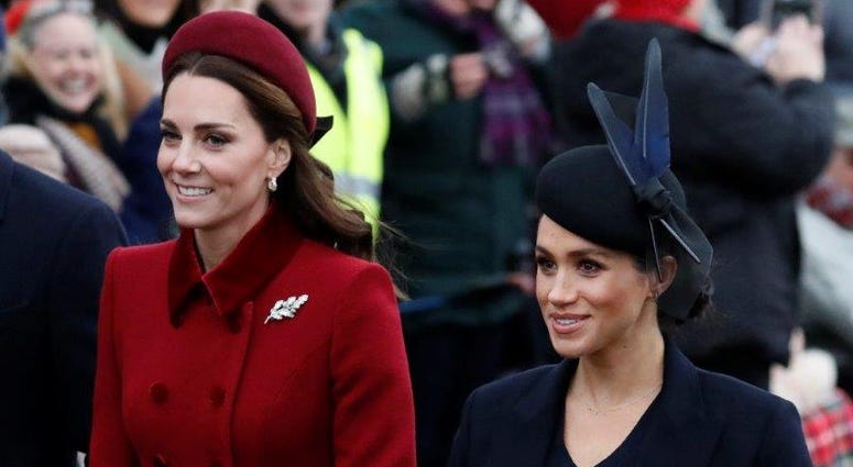 FILE - In this Tuesday, Dec. 25, 2018 file photo, Britain's Kate, Duchess of Cambridge, left, and Meghan, Duchess of Sussex arrive to attend the Christmas day service at St Mary Magdalene Church in Sandringham in Norfolk, England.