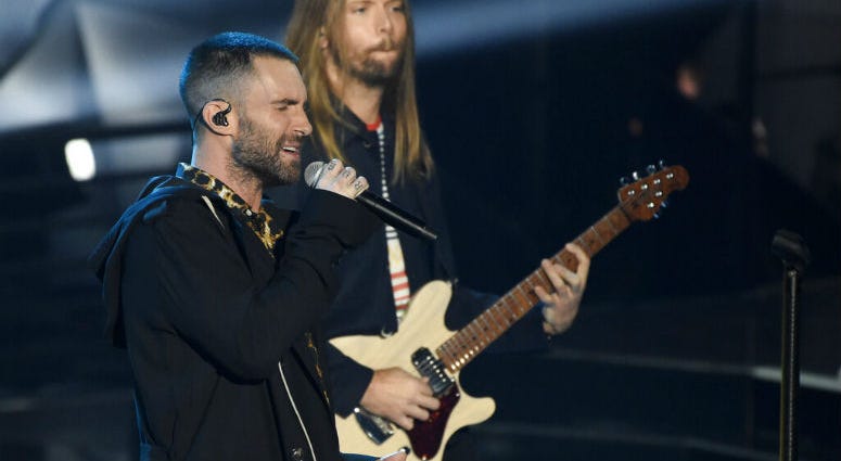 FILE - In this Sunday, March 11, 2018 file photo, Adam Levine, left, and James Valentine of Maroon 5 perform during the 2018 iHeartRadio Music Awards at The Forum in Inglewood, Calif. FILE - In this Sunday, March 11, 2018 file photo, Adam Levine, left, and James Valentine of Maroon 5 perform during the 2018 iHeartRadio Music Awards at The Forum in Inglewood, Calif.