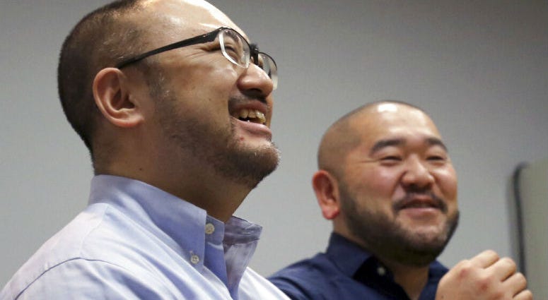 In this Jan. 28, 2019, photo, Kenji Aiba, left, and his partner Ken Kozumi laugh during an interview with The Associated Press in Tokyo. In this Jan. 28, 2019, photo, Kenji Aiba, left, and his partner Ken Kozumi laugh during an interview with The Associated Press in Tokyo.