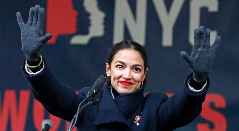 In this Jan. 19, 2019, file photo, U.S. Rep. Alexandria Ocasio-Cortez, (D-New York) waves to the crowd after speaking at Women's Unity Rally in Lower Manhattan in New York. U.S. Rep. Alexandria Ocasio-Cortez