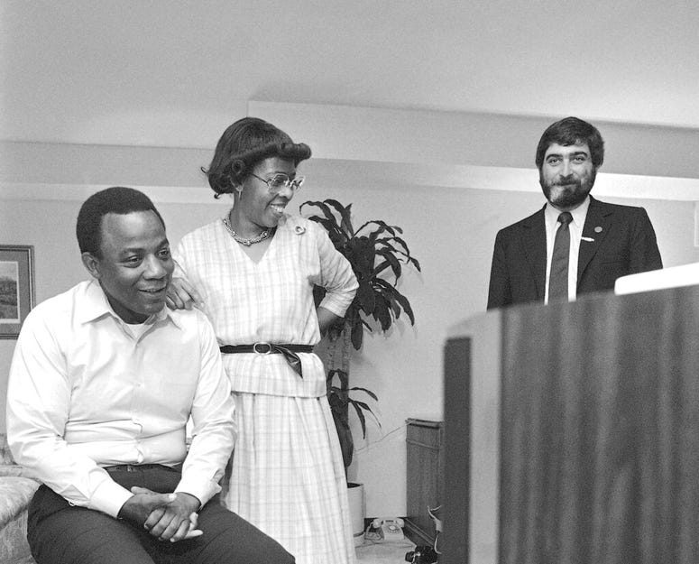 In this May 17, 1983 photo, W. Wilson Goode and his wife Velma smile as they react to the news on TV of a heavy black voter turnout in the Democratic primary election at the Philadelphia Centre Hotel. Pollster Patrick Caddell is on right. In this May 17, 1983 file photo, W. Wilson Goode and his wife Velma smile as they react to the news on television of a heavy black voter turn out in west Philadelphia in the Democratic primary election at the Philadelphia Centre Hotel.