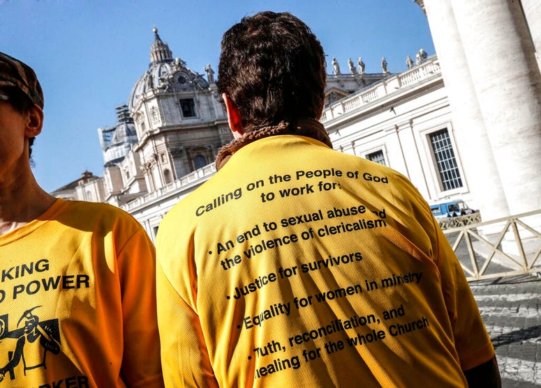 Demonstrators wear shirts as they stand outside St. Peter's Square on the day of the opening of a sex abuse within the Catholic church prevention summit, at the Vatican, Thursday, Feb. 21, 2019. Demonstrators wear shirts as they stand outside St. Peter's Square on the day of the opening of a sex abuse within the Catholic church prevention summit, at the Vatican, Thursday, Feb. 21, 2019.