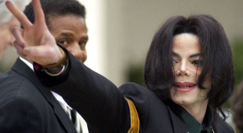 FILE - In this March 2, 2005 file photo, pop icon Michael Jackson waves to his supporters as he arrives for his child molestation trial at the Santa Barbara County Superior Court in Santa Maria, Calif. FILE - In this March 2, 2005 file photo, pop icon Michael Jackson waves to his supporters as he arrives for his child molestation trial at the Santa Barbara County Superior Court in Santa Maria, Calif.