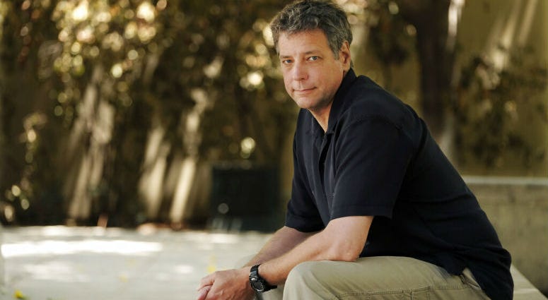 FILE - In this June 20, 2018, file photo, Michael Scott Moore, author of "The Desert and the Sea: 977 Days Captive on the Somali Pirate Coast," poses for a portrait at Los Angeles Public Library in Los Angeles. FILE - In this June 20, 2018, file photo, Michael Scott Moore, author of "The Desert and the Sea: 977 Days Captive on the Somali Pirate Coast," poses for a portrait at Los Angeles Public Library in Los Angeles.