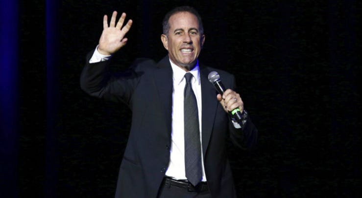 FILE - In this Nov. 1, 2016 file photo, Jerry Seinfeld performs at Stand Up For Heroes, at The Theater in New York's Madison Square Garden. FILE - In this Nov. 1, 2016 file photo, Jerry Seinfeld performs at Stand Up For Heroes, at The Theater in New York's Madison Square Garden.