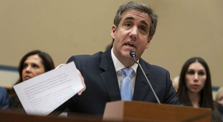 FILE - In this Wednesday, Feb. 27, 2019 file photo, Michael Cohen, President Donald Trump's former personal lawyer, reads an opening statement as he testifies before the House Oversight and Reform Committee on Capitol Hill in Washington. FILE - In this Wednesday, Feb. 27, 2019 file photo, Michael Cohen, President Donald Trump's former personal lawyer, reads an opening statement as he testifies before the House Oversight and Reform Committee on Capitol Hill in Washington.