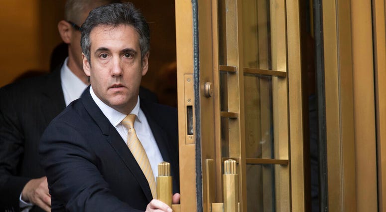 In this Aug. 21, 2018, file photo, Michael Cohen leaves federal court, in New York. Newly released documents show the FBI was investigating President Donald Trump's former personal attorney and fixer for nearly a year before agents raided his home and off Michael Cohen