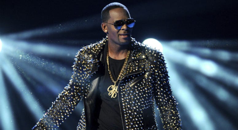 FILE - In this June 30, 2013 file photo, R. Kelly performs at the BET Awards in Los Angeles. R. Kelly performs at the BET Awards in Los Angeles.